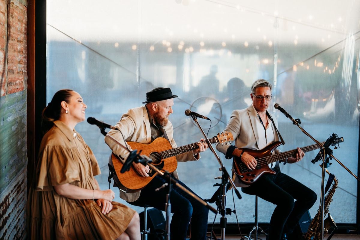 Duke Music trio performing with vocals, acoustic guitar and bass at Eileen and Patrick’s wedding reception.